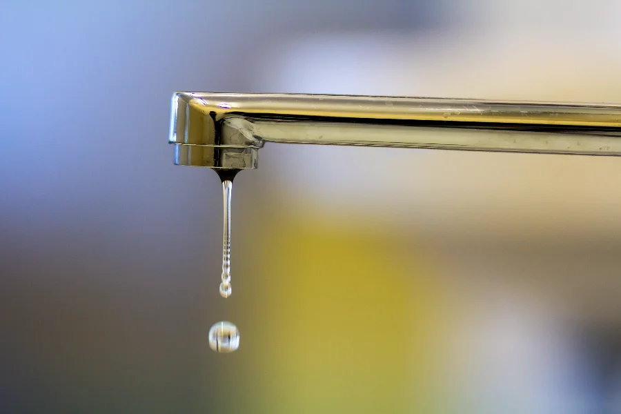 leaky faucet kitchen close up