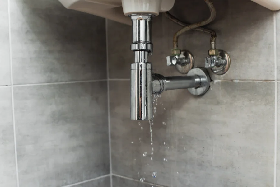 pipe leak under sink water damage